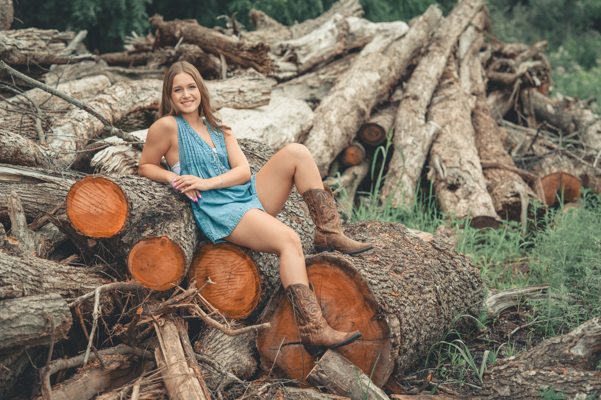 Western boots, denim and Kent Park's wood pile for senior pictures